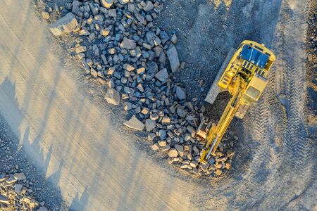 excavator on an construction site from above