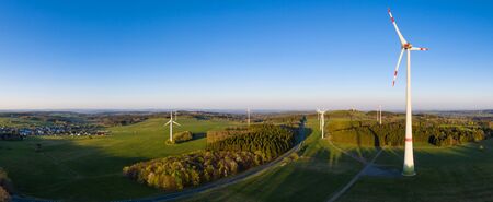 wind wheels in the evening high definition panoramaの写真素材