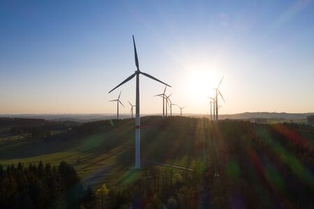 some wind wheels in an evening sundownの写真素材