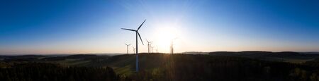 wind wheels in an evening sundown high definition panoramaの写真素材