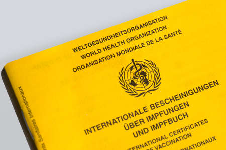 siegen, north rhine westphalia, germany - 06 05 2021: an international who vaccination certificateのeditorial素材