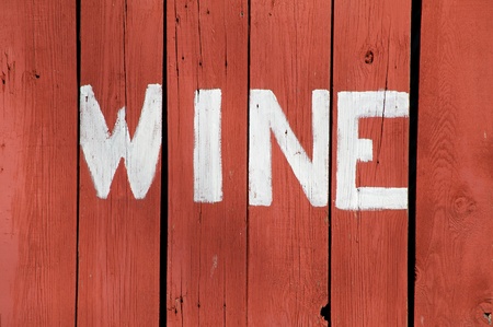 The word Wine is painted on the side of old barn boards.の写真素材