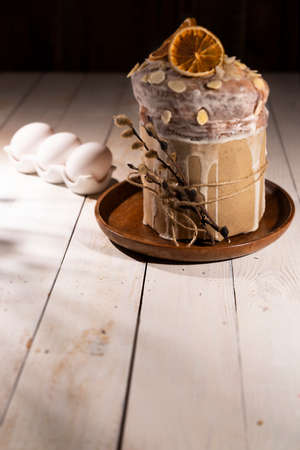 Easter cake with eggs on wooden table