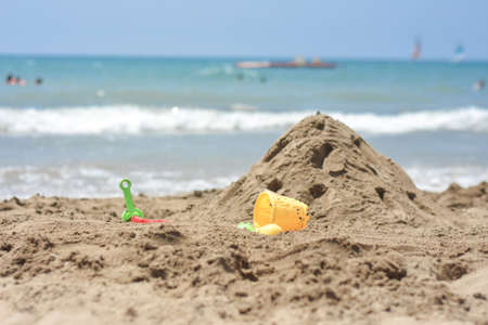 Sand Castle on the seaside. Summer fun and activity on the Beach. Mediterranean sea. Playing with Sand.の写真素材