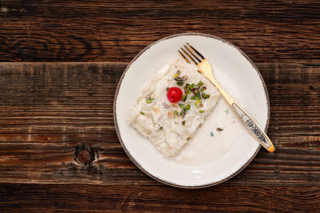 Traditional Turkish milky Ramadan Dessert named Gullac with sugar, powder of pistachio, milk and...