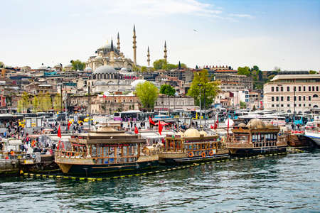 ISTANBUL, TURKEY - APRÄ°L 26, 2019: otantic boats in Eminonu pier, wich sell famous popular traditional fish sandwich. Turkish food. Gastronomic tours to Istanbul.のeditorial素材