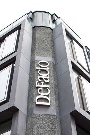 ISTANBUL, TURKEY - APRÄ°L 26, 2019: logo of the popular Turkish clothing brand De Facto on the building. De Facto is one of the leading ready-to-wear fashion labels in Turkey.のeditorial素材