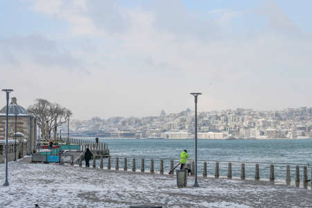Magnificent view of coastline in Uskudar, Istanbul,Turkey. People walking near Bosphorus in winter day with many snow. Istanbul's main attractions.の写真素材