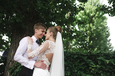 Bride and groom having fun in the woodsの写真素材
