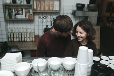 Vintage couple preparing coffee. Coffee shopの写真素材