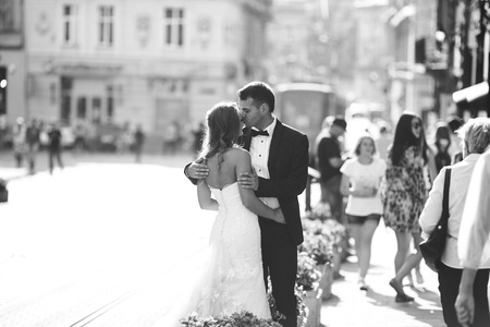 Beautiful wedding couple is walking around the cityの写真素材