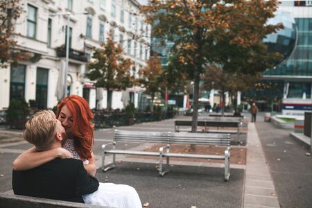 Wedding couple close to each other having fun in the cityの写真素材