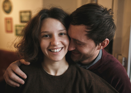 vintage couple hugs and laughing .coffee shop.の写真素材