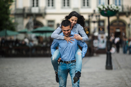 beautiful couple having fun and walking at the big cityの写真素材