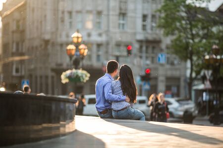 beautiful couple walking on the evening cityの写真素材