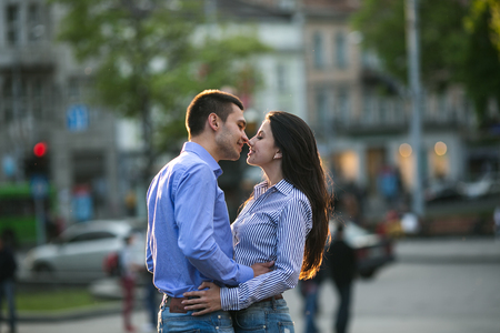 beautiful couple walking on the evening cityの写真素材