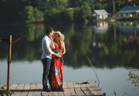 beautiful couple on nature by the lakeの写真素材