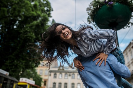beautiful couple having fun and walking at the big cityの写真素材