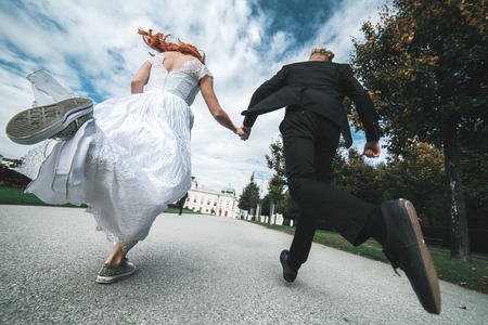 Wedding couple on a walk in the estate of the Belvedere in Viennaの写真素材