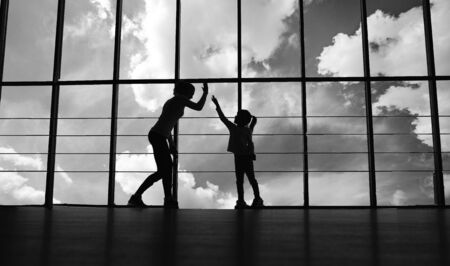 Charming family spends time in the gymの写真素材