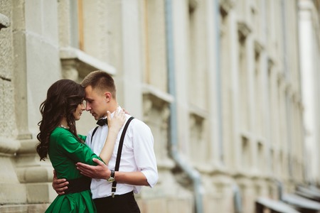 Photo of a beautiful couple hugging on the street thatの写真素材