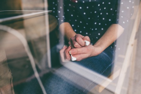 Beautiful girl works with nano  technologise on the phone and smilesの写真素材