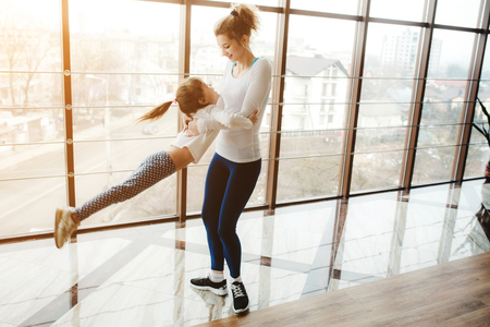 Charming family spends time in the gymの写真素材