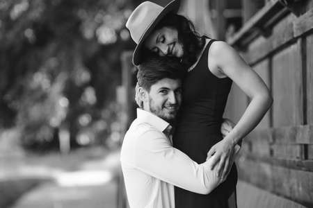 man and woman embracing each other in the park
