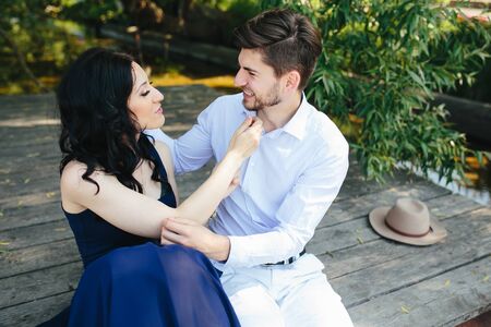 man and woman at the lake to spend time in each other's armsの写真素材