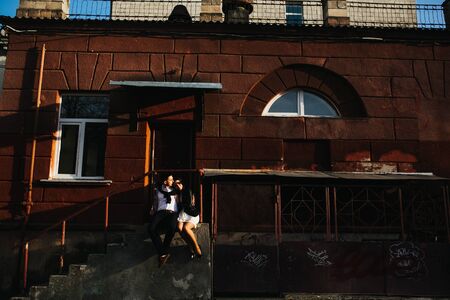 beautiful couple hugging and having fun in the cityの写真素材