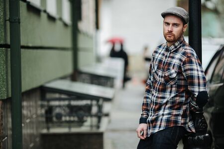 The man in the authentic boots and selvedge jeans  on the streetの写真素材