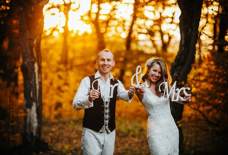 Photo of a couple holding a speech on the background of the forestの写真素材