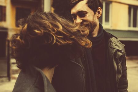 charming couple walking down the street.