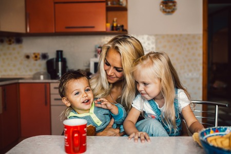 Mother with family haveing fun at kitchenの写真素材
