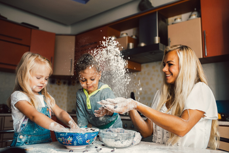 Mother with family haveing fun in the kitchenの写真素材