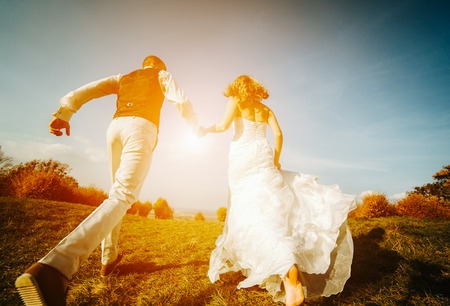 beautiful couple having fun on the lawnの写真素材