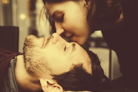 vintage couple hugs and laughing .coffee shop