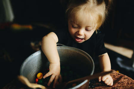 little girl playing in a witch on Halloweenの写真素材