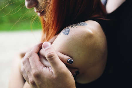 guy hugging his girlfriend from the backの写真素材