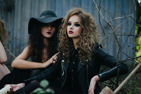 Two vintage witches gathered for the sabbat eve of Halloweenの写真素材