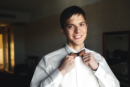 groom morning preparing for the wedding and posing for the cameraの写真素材