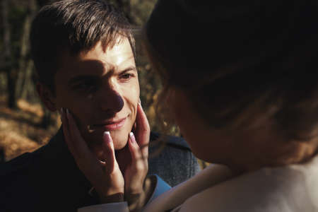 bride and groom in a park somewhere, meeting, close to the angleの写真素材