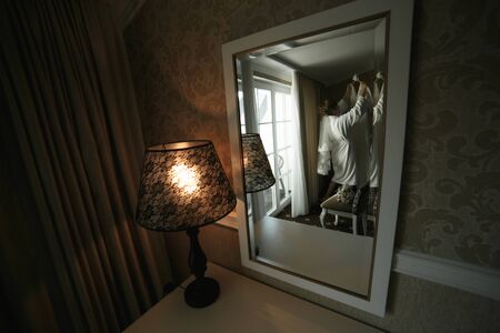 beautiful gorgeous stylish bride getting prepared in the morning in the roomの写真素材