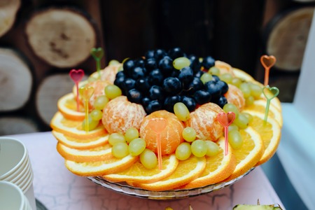 Carved fruits arrangement. Fresh various fruits. Assortment of exotic fruits. Fresh fruits decorationの写真素材