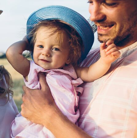 father and daughter enjoying a walk in nature.