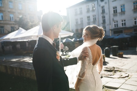 bride and groom posing on the streets of the old city, close to the angleの写真素材