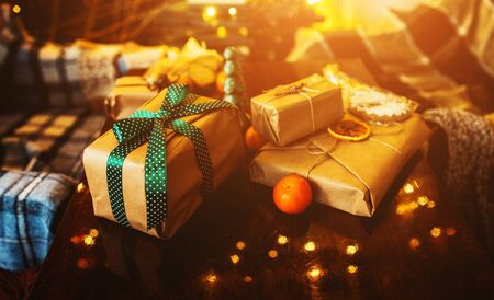 Beautiful themed gifts lie on wooden tableの写真素材