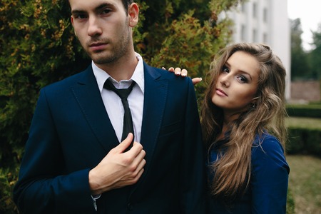 Girl and boy posing in the parkの写真素材