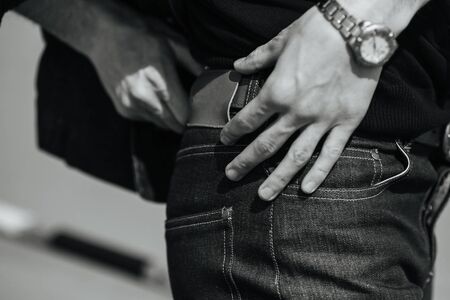 A man dressed in jeans, a close-up shotの写真素材