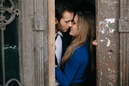 man and woman posing in door of an old houseの写真素材